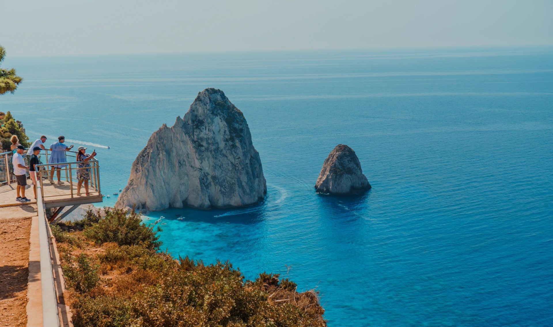 Cinematic aerial view of a bright blue coastline